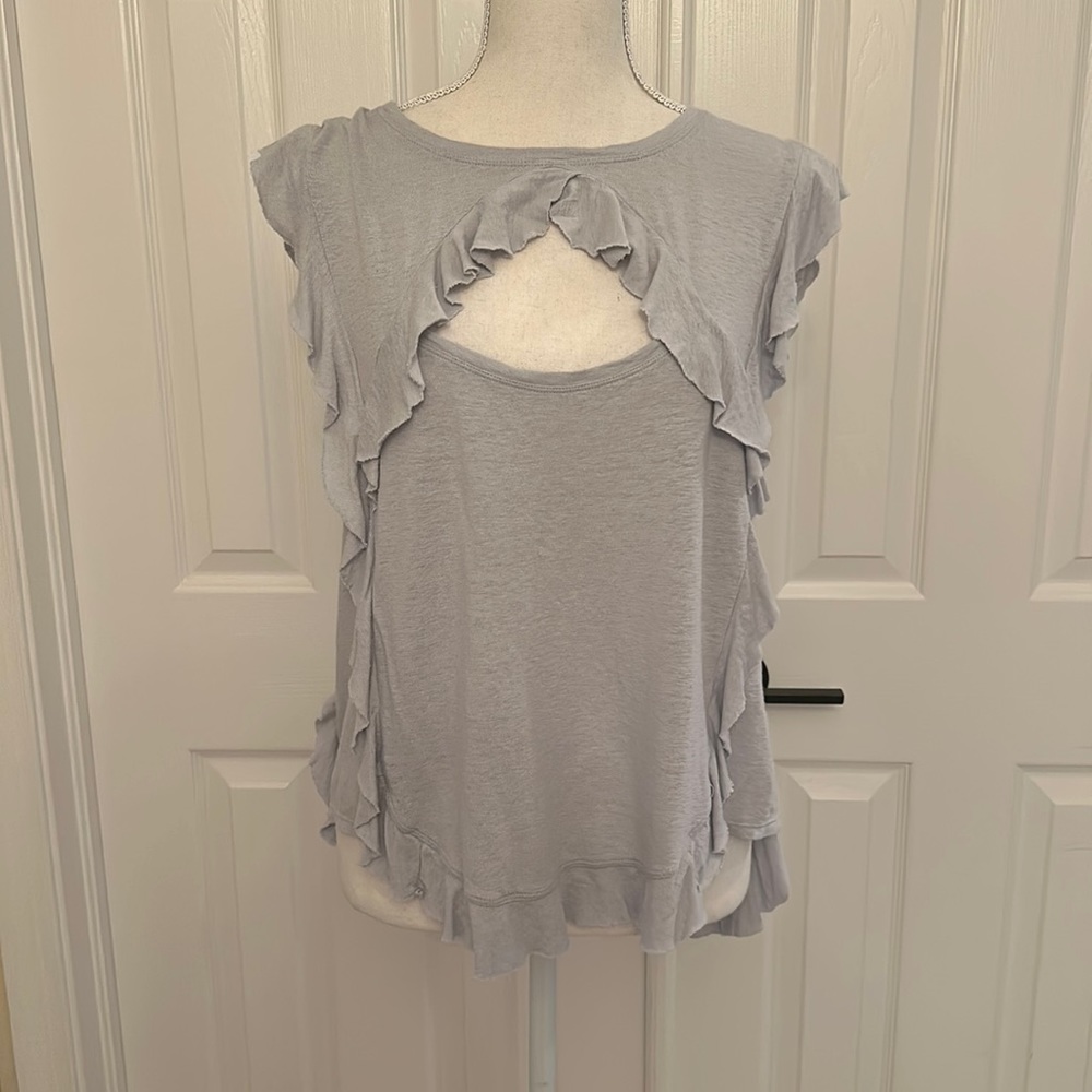 Grey/blue ruffle BCBGMAXAZRIA t-shirt with cute cutout above the chest. Worn 2x